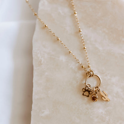 14K gold filled custom charm necklace with multiple dainty charms on delicate chain