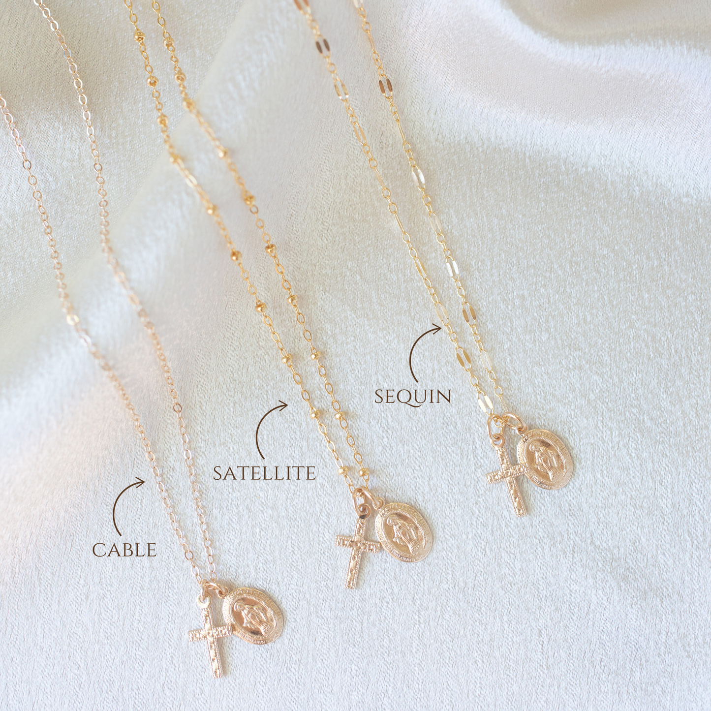 Flat lay of 14k gold filled Virgin Mary cross necklace, dainty Catholic necklace